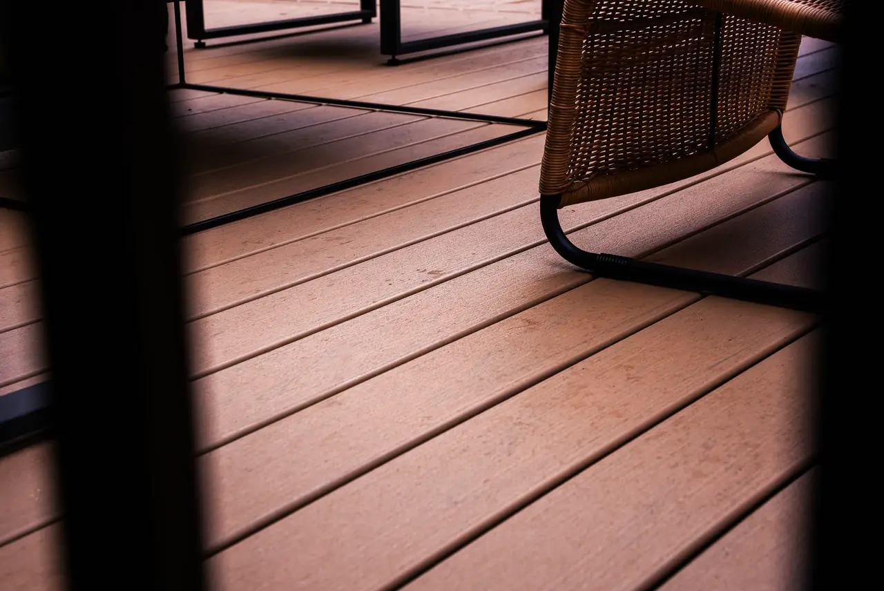 Close-up of Trex Transcend Lineage boards in Carmel under a garden chair